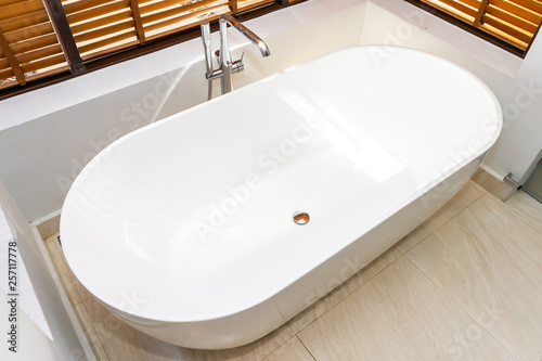 Beautiful luxury and comfortable white bathtub decoration in bathroom interior