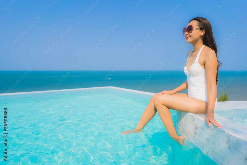 Portrait beautiful young asian woman happy smile relax in swimming pool for travel vacation Portrait beautiful young asian woman happy smile relax in swimming pool for travel vacation