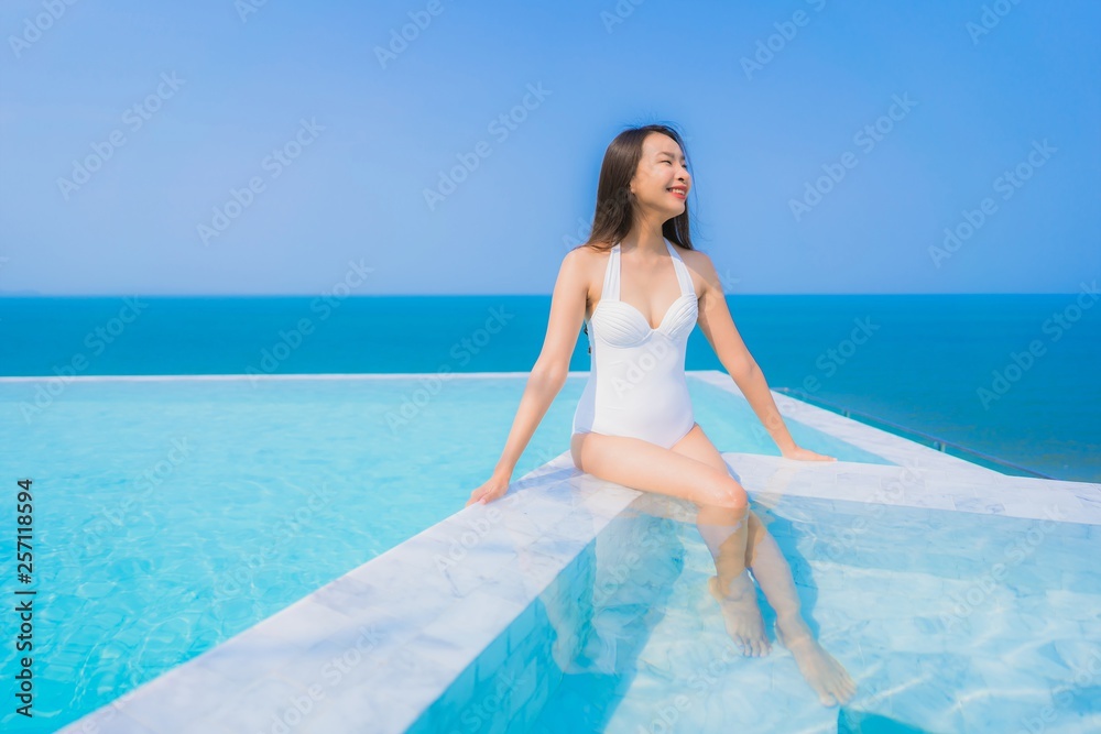 Portrait beautiful young asian woman happy smile relax in swimming pool for travel vacation Portrait beautiful young asian woman happy smile relax in swimming pool for travel vacation
