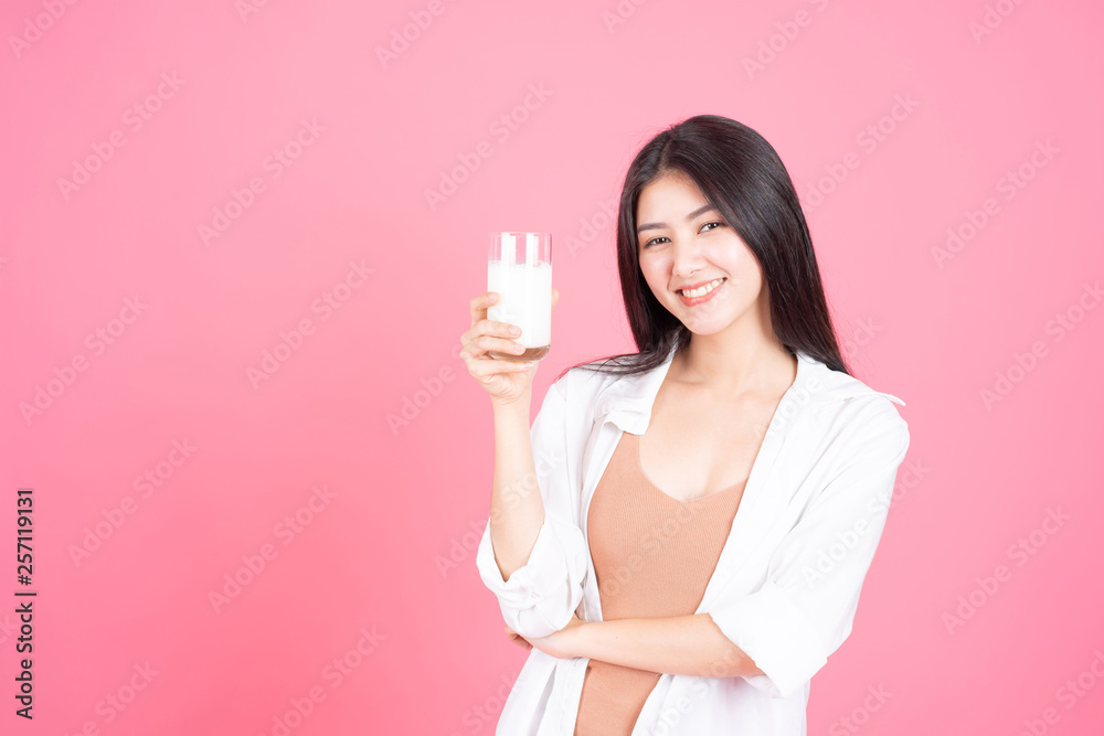 beauty woman Asian cute girl feel happy drinking milk for good health in the morning on pink background - lifestyle beauty woman beauty woman Asian cute girl feel happy drinking milk for good health in the morning on pink background - lifestyle beauty woman