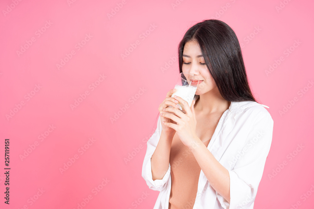 beauty woman Asian cute girl feel happy drinking milk for good health in the morning on pink background - lifestyle beauty woman beauty woman Asian cute girl feel happy drinking milk for good health in the morning on pink background - lifestyle beauty woman
