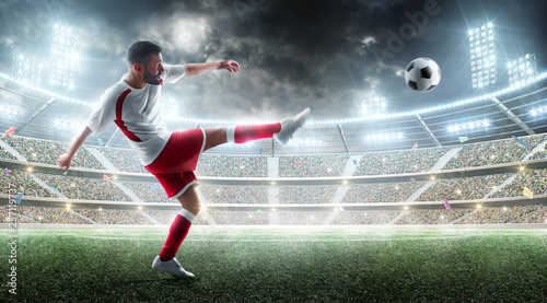Sport. Professional soccer player kicking a ball. Night 3d stadium with fans and flags. Soccer concept. Soccer action