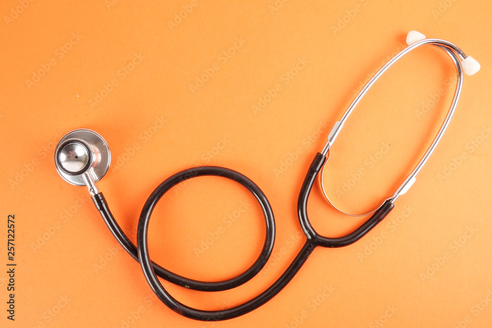 Medical Concept with stethoscope ,syringe isolated on orange background. Copy Space Medical Concept with stethoscope ,syringe isolated on orange background. Copy Space