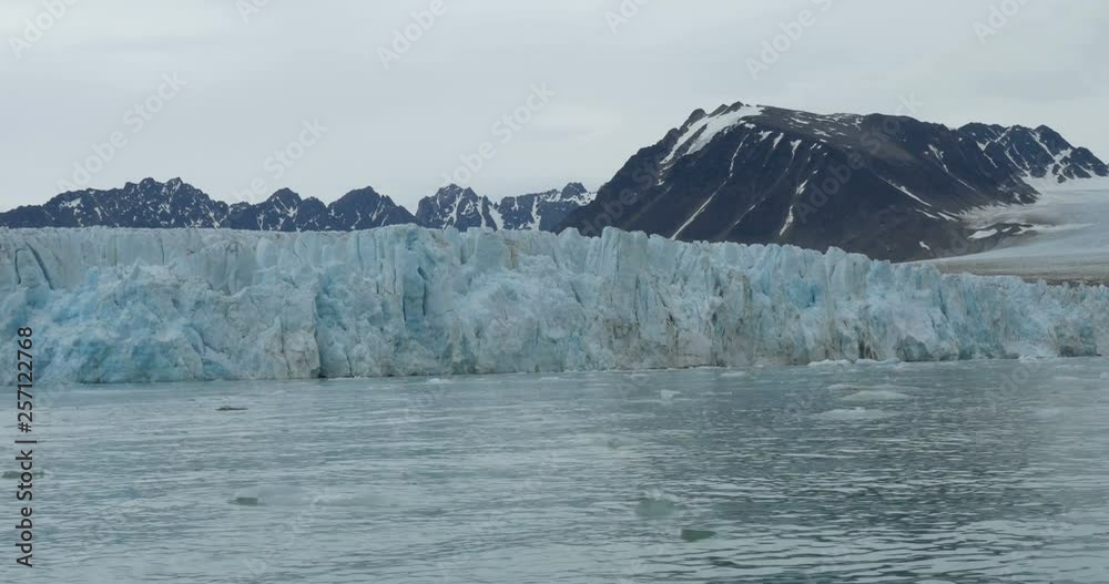Sailing near large Iceberg in Spitsbergen Sailing near large Iceberg in Spitsbergen