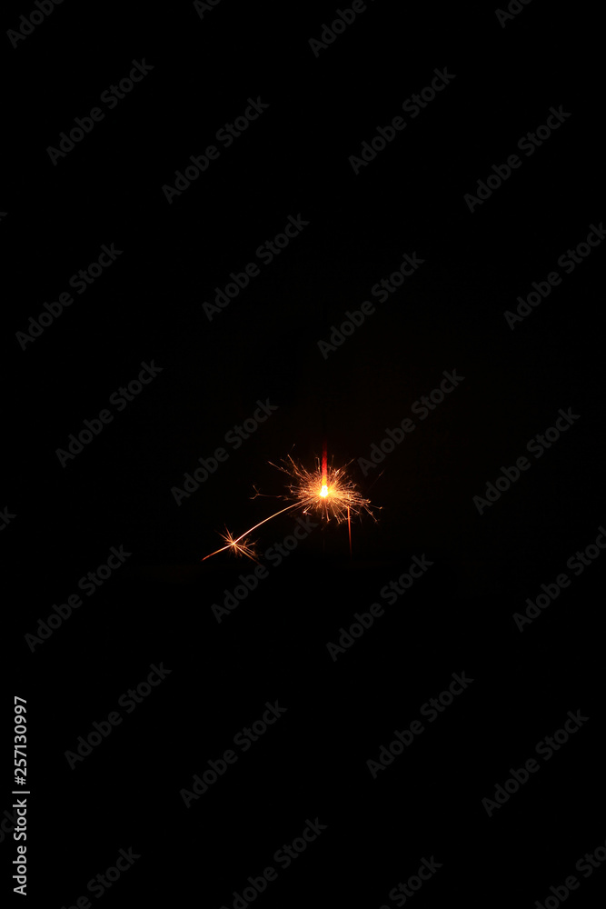 Fototapeta premium yellow sparks on a black background