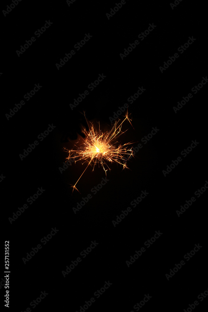 yellow sparks on a black background