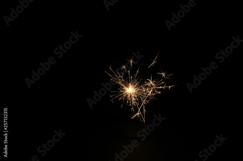 yellow sparks on a black background