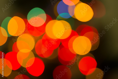 Abstract bokeh background of lights red and orange on a dark