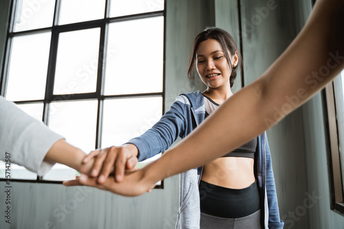 friend sport shake hand in the gym after exercising together