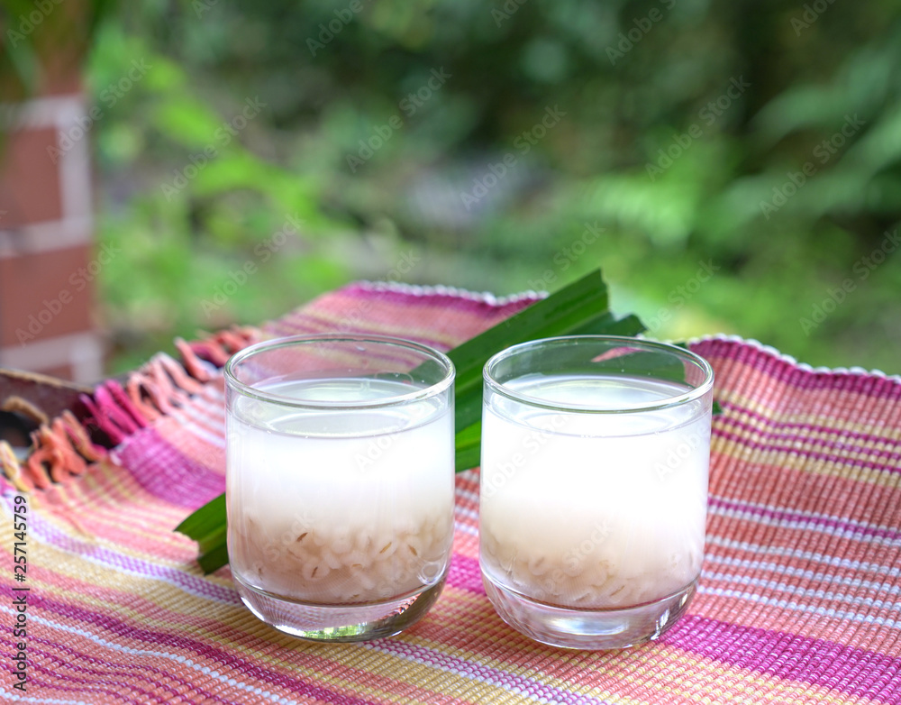 Barley water in glass and cooked pearly barley with pandan leaves Barley water in glass and cooked pearly barley with pandan leaves
