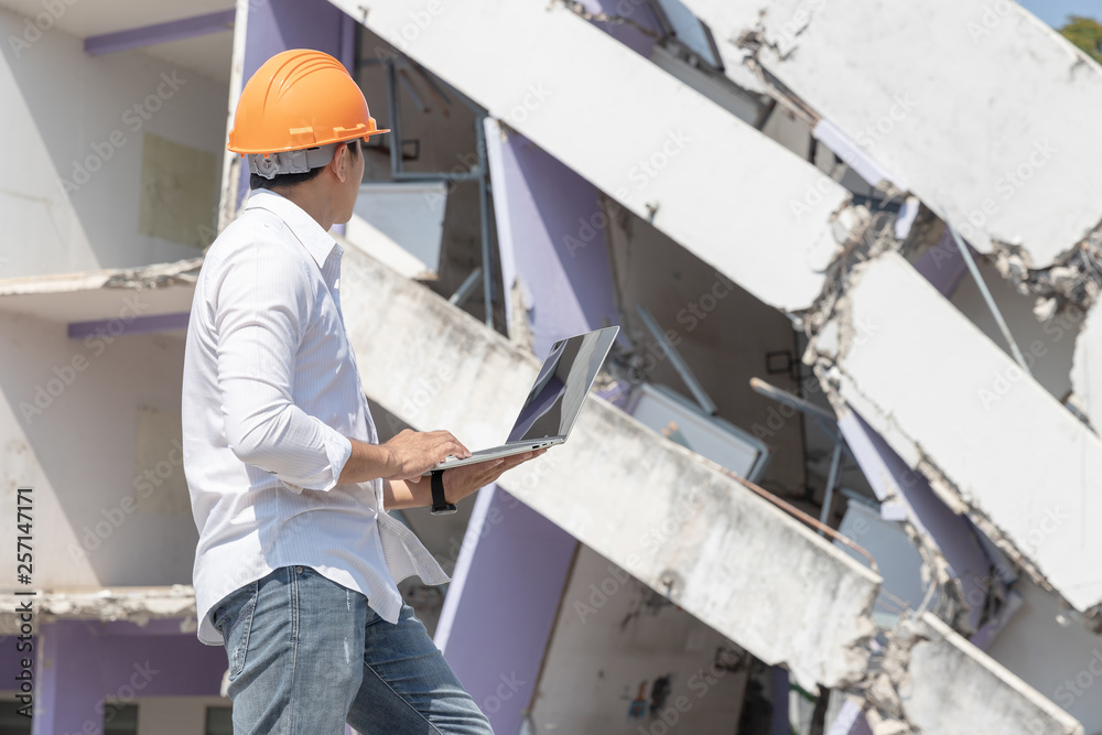 Engineer architect and worker operation control demolish old building. Engineer architect and worker operation control demolish old building.