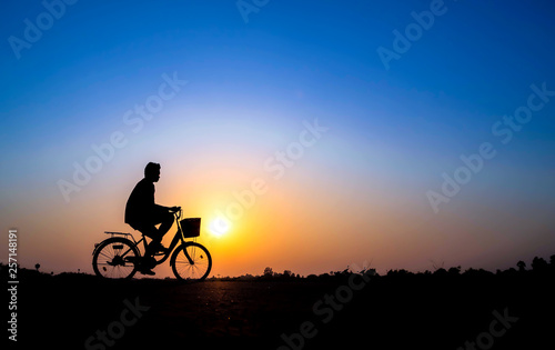 cyclist on sunset background