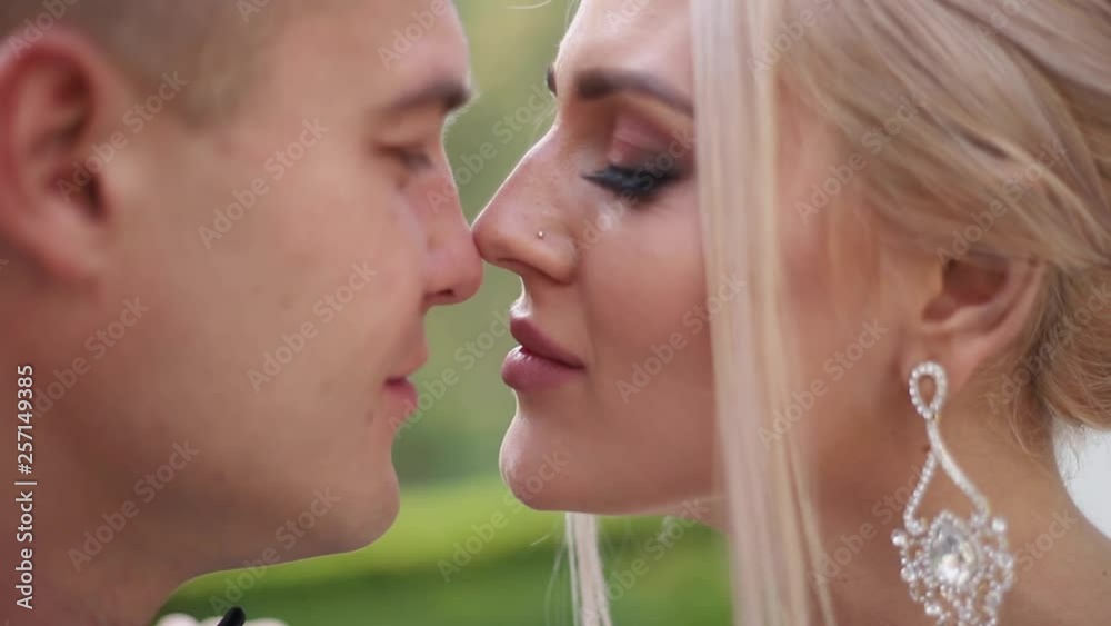Close up of groom and bride. Beautiful wedding couple in the park. Stylish newlyweds Close up of groom and bride. Beautiful wedding couple in the park. Stylish newlyweds
