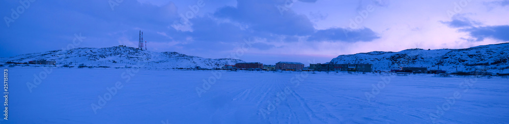 Panorama of the village of Teriberka in February twilight. Murmansk region, Russia