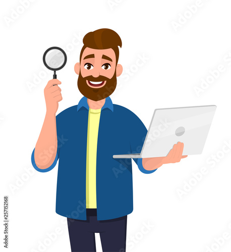 Smart bearded young man showing/holding magnifying glass and laptop computer in hand. Search, find, discovery, analyze, inspect, investigation concept illustration in vector cartoon flat style.