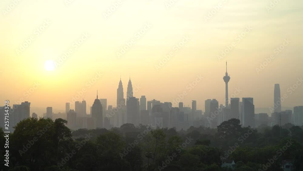 4k UHD establishing cinematic b-roll shot of sunrise scene at Kuala Lumpur city skyline during hazy and misty season. 4k UHD establishing cinematic b-roll shot of sunrise scene at Kuala Lumpur city skyline during hazy and misty season.
