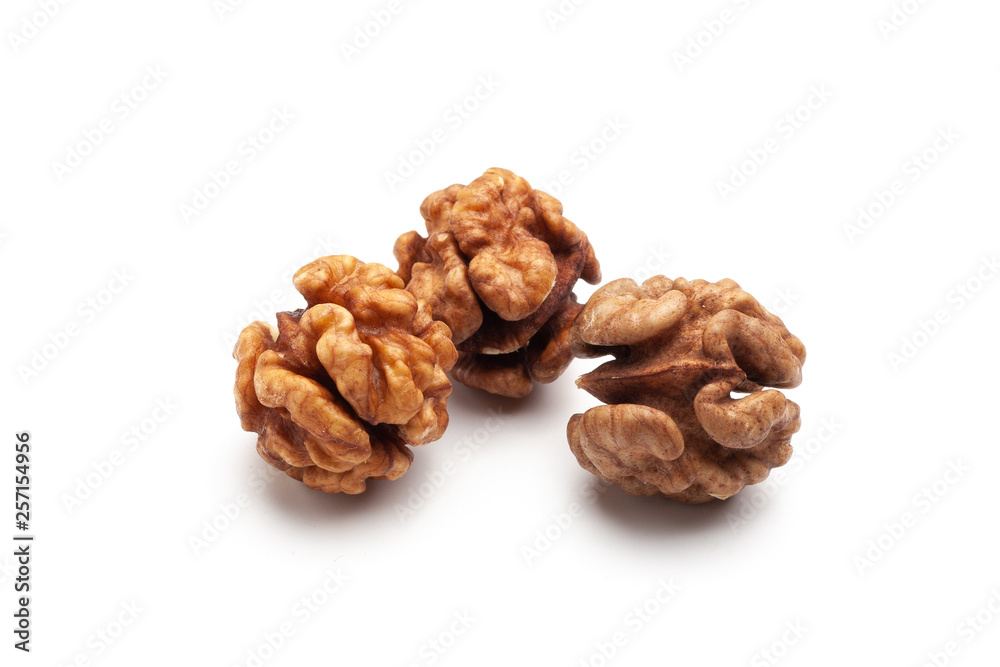 Three pieces of whole peeled walnut on white background Three pieces of whole peeled walnut on white background
