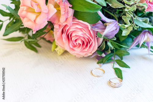 Two wedding rings in flowers. Close up. Engagement photo