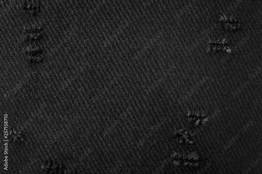 Black fabric texture. Background of dark material made from cloth. Torn textile. Black fabric texture. Background of dark material made from cloth. Torn textile.