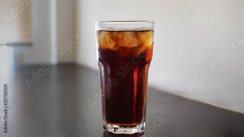 glass of cola with ice