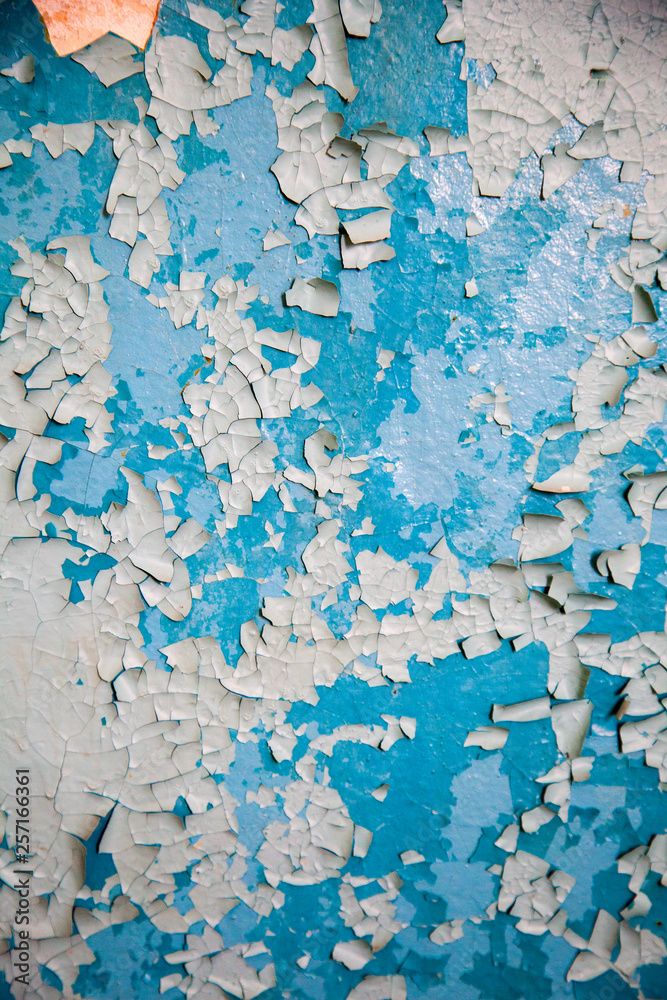 Aged wall plaster blue and white rough surface, grunge texture of the wall old paint.