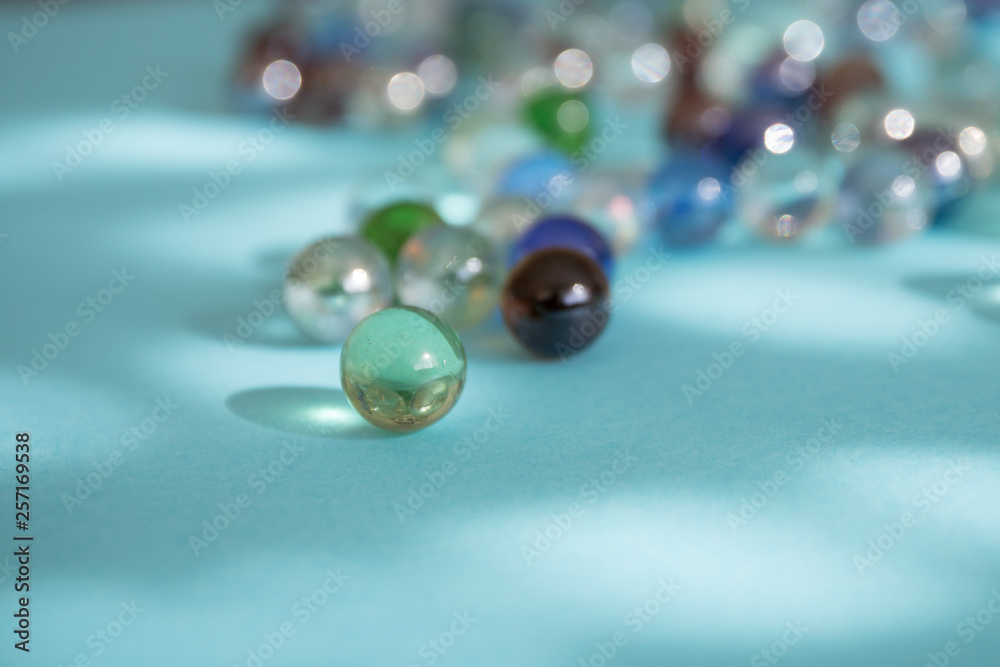 Colored beads on blue background Colored beads on blue background
