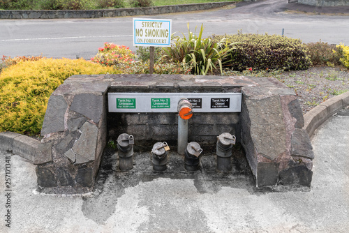 Diesel and petrol tanks underground with filling pipes  locked with locks photo