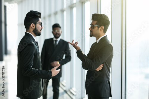 Two businessmen discussing at office during business meeting in front of business partner before decision. © F8  \ Suport Ukraine