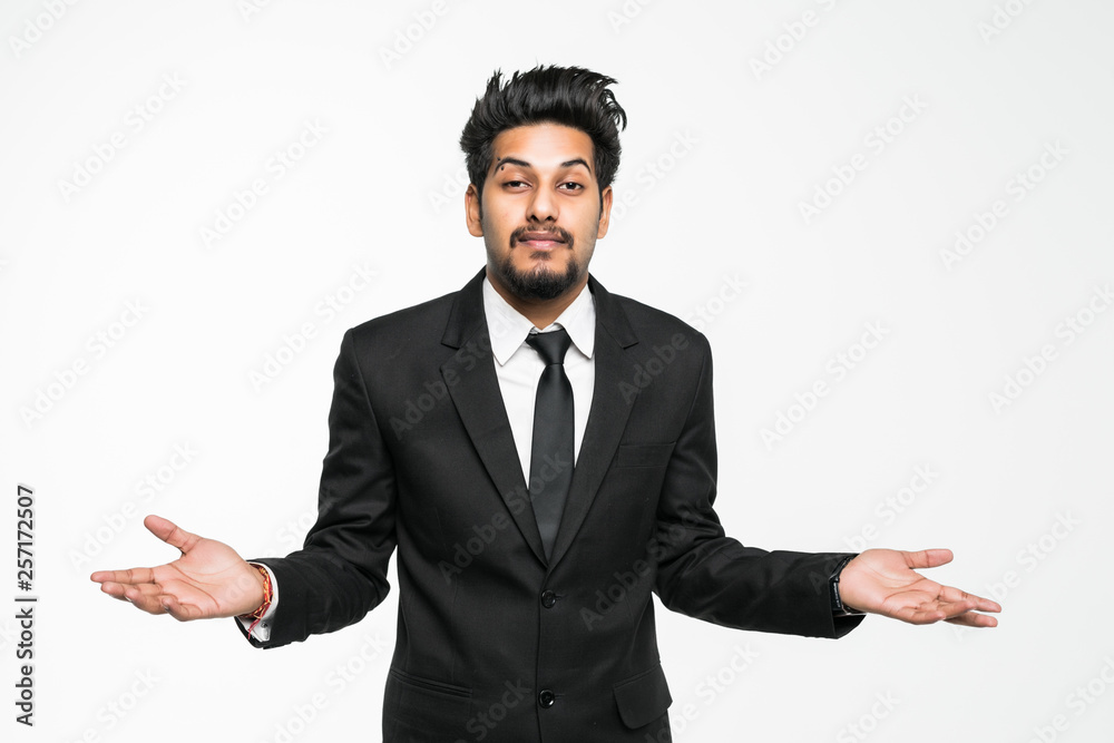Indian young businessman confused with doubt gesture isolated on white background Indian young businessman confused with doubt gesture isolated on white background