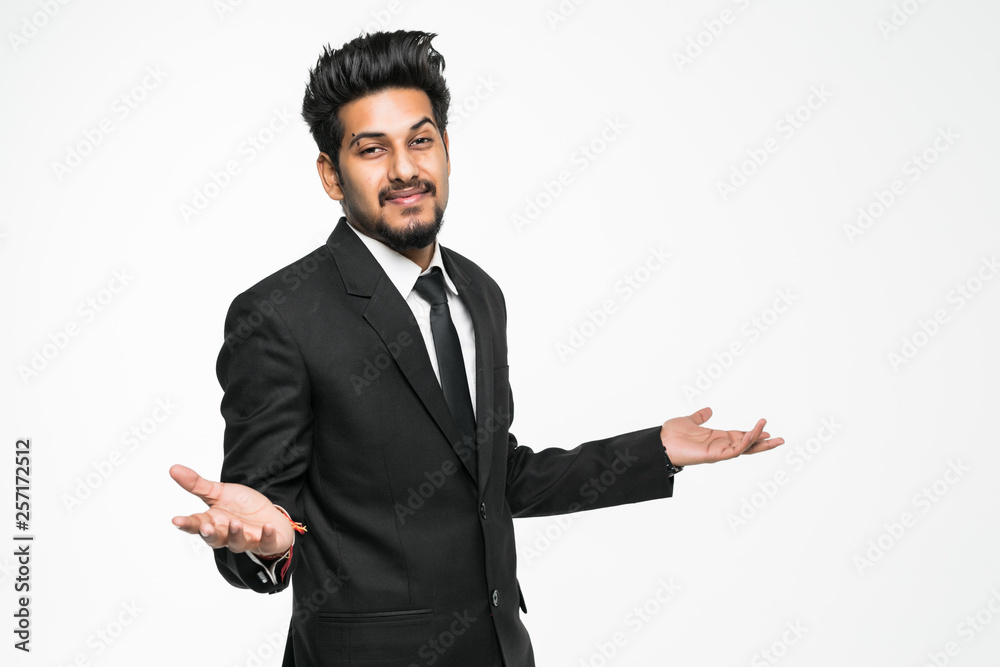 Indian young businessman confused with doubt gesture isolated on white background Indian young businessman confused with doubt gesture isolated on white background