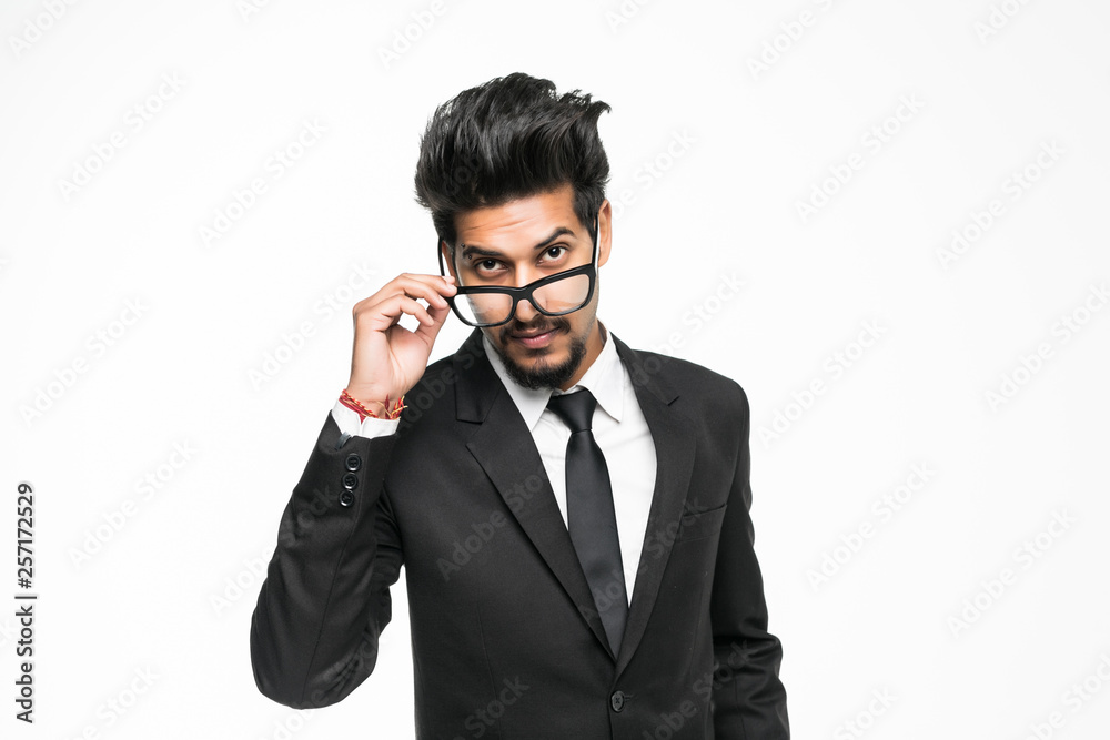 Portrait of handsome young indian businessman isolated on white background. Positive human emotions facial expressions, feelings, attitude perception Portrait of handsome young indian businessman isolated on white background. Positive human emotions facial expressions, feelings, attitude perception