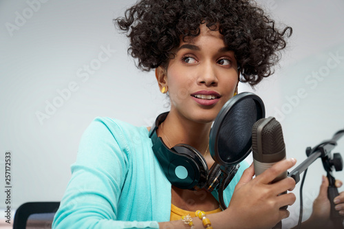 Attractive African American Young Woman Doing Online Podcast With Microphone