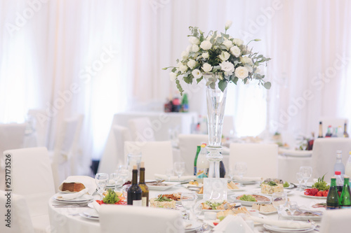 Floral decoration on the wedding table in the restaurant © Aleksandr