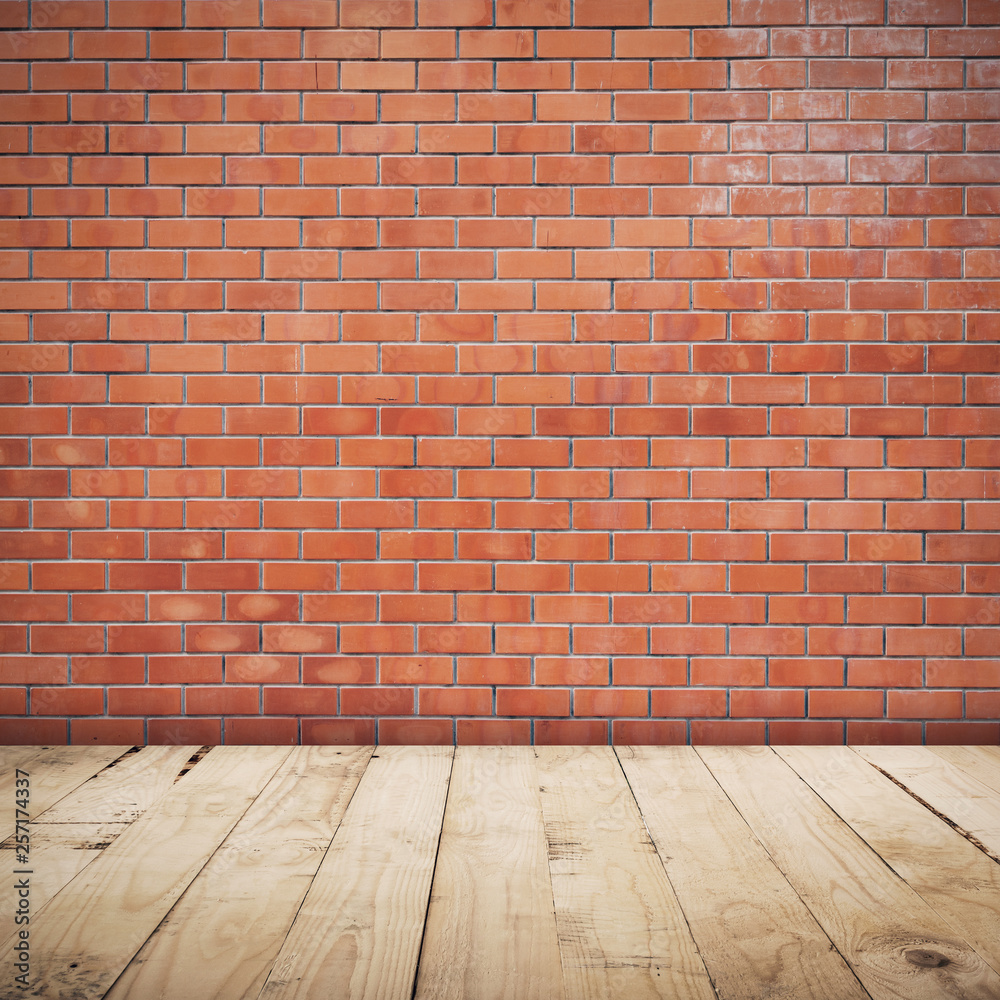 Brick wall room and wood floor background and texture with copy space.