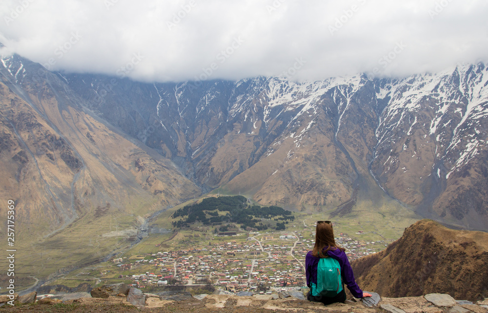 lanscape of girl in mountain with village on backround