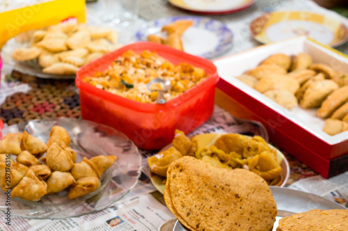 Mix of north indian snacks on the table in home