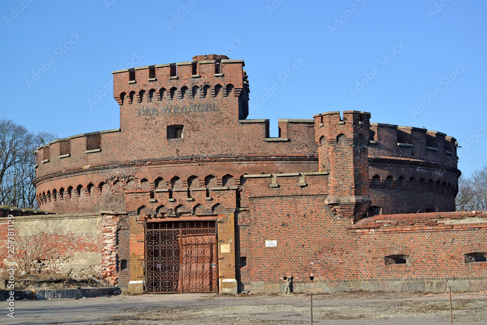 Tower of Der Wrangel  against the background of the blue sky. Kaliningrad. The German text - Wrangel Tower