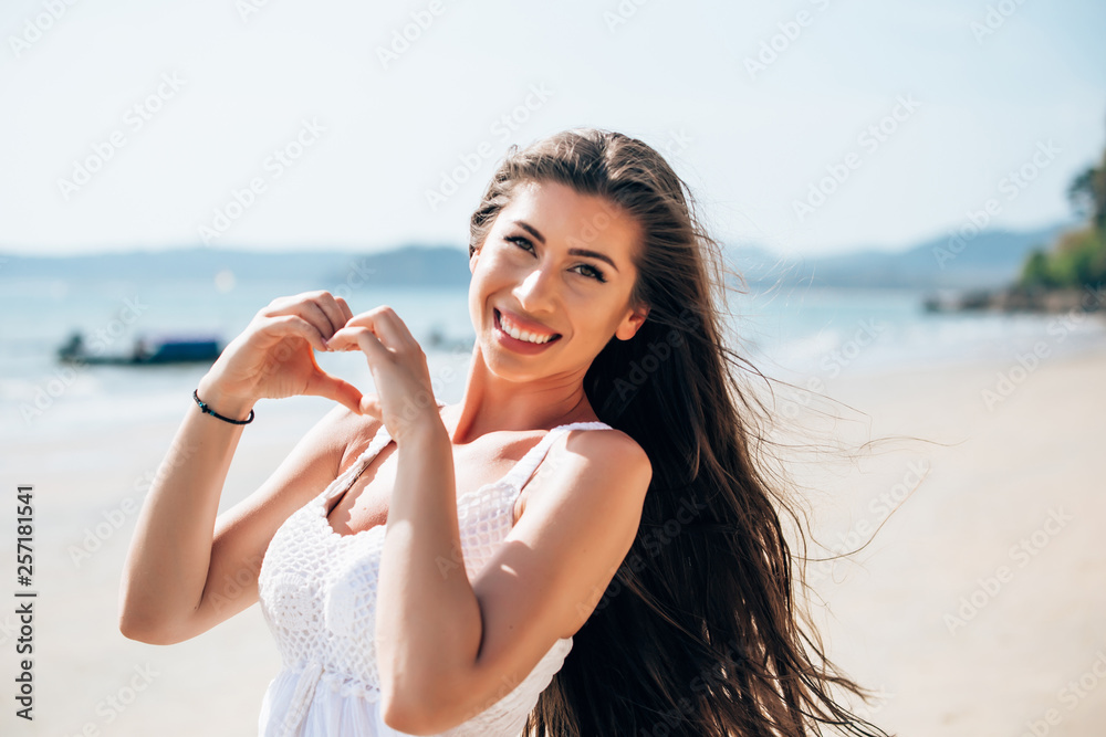 Young woman making heart shape gesture. Reflection of love.,Young woman making heart shape gesture. Reflection of love. Young woman making heart shape gesture. Reflection of love.,Young woman making heart shape gesture. Reflection of love.