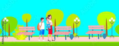 mother with schoolboy and baby boy walking in city public park happy family woman with two children enjoying walk outdoor landscape background full length horizontal