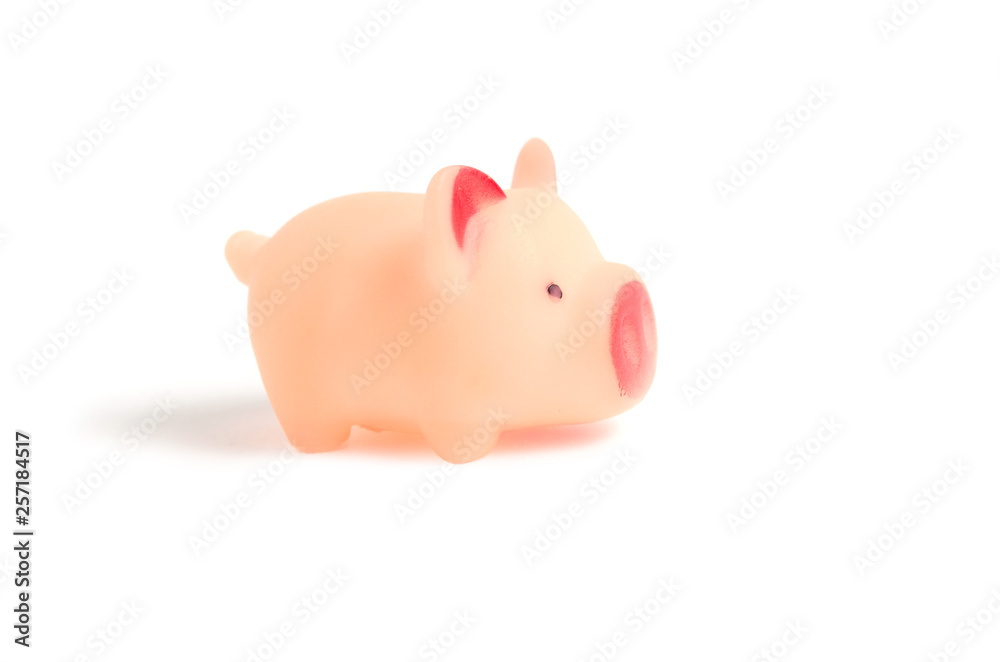 Little rubber, pink pig, toy on white background.