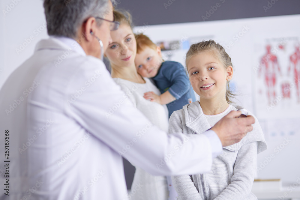 Little children with her mother at a doctor on consultation Little children with her mother at a doctor on consultation