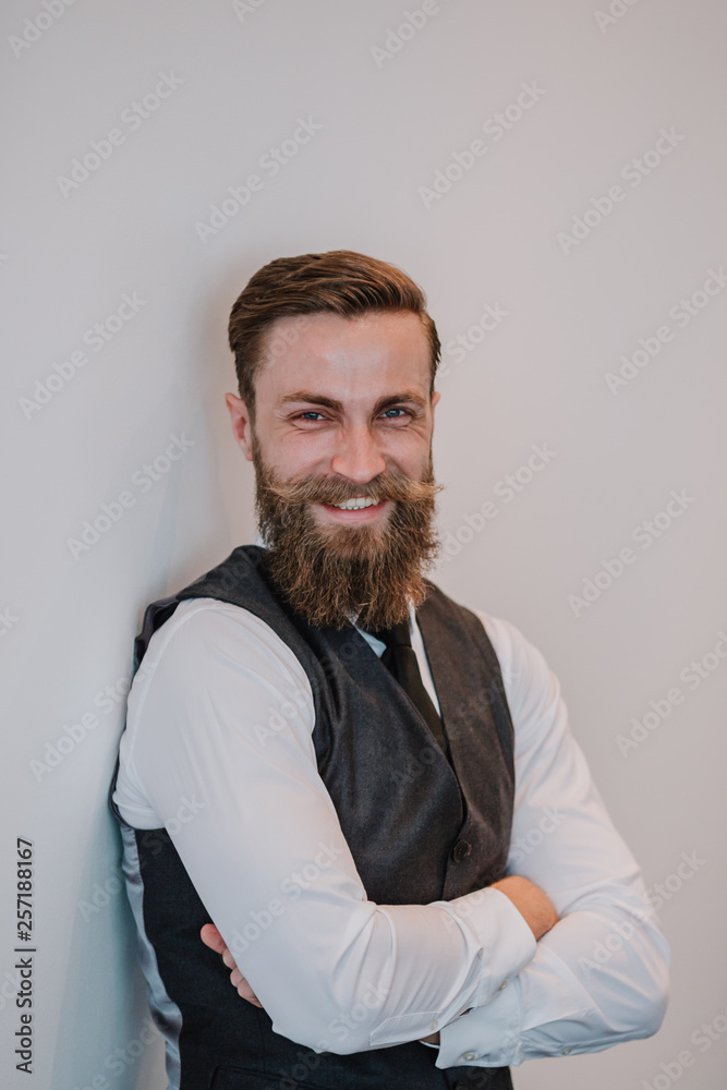 Fototapeta premium Handsome young bearded hipster businessman