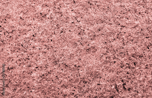Granite background close up. Bright hard pink granite rock texture for template or mock up.