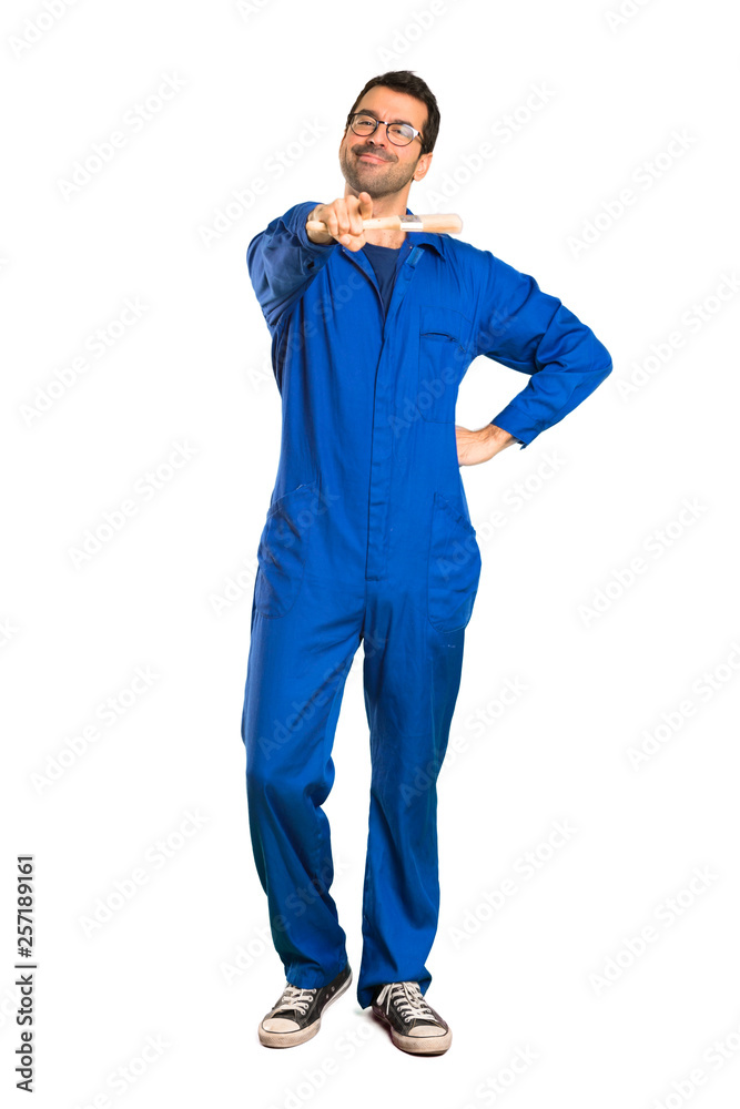 Fototapeta premium A full-length shot of a Painter man points finger at you with a confident expression on isolated white background