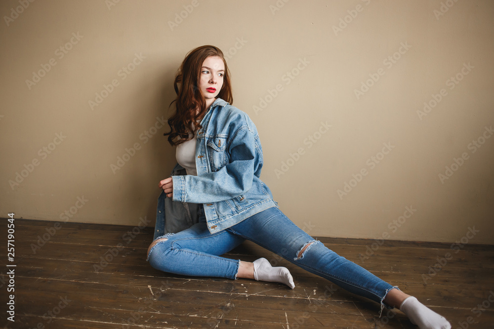 Gorgeous brunette girl with long flowing hair dressed in jeans jacket and jeans  poses standing on | Photography poses women, Girl photo poses, Photo poses  for couples