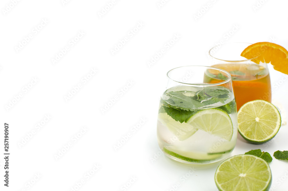 Glasses with citrus cocktails are on a white background Glasses with citrus cocktails are on a white background