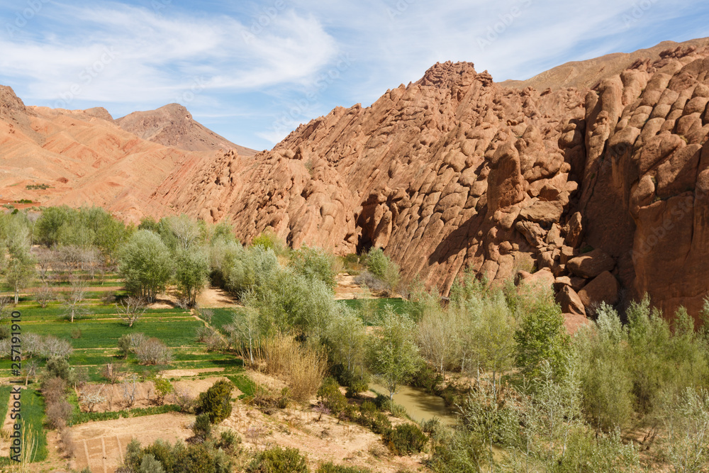 Fortified city along the former caravan route between the Sahara and Marrakech in Morocco with snow covered Atlas mountain range in background Fortified city along the former caravan route between the Sahara and Marrakech in Morocco with snow covered Atlas mountain range in background