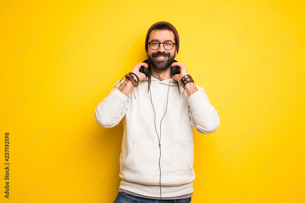 Hippie man with dreadlocks with headphones Hippie man with dreadlocks with headphones