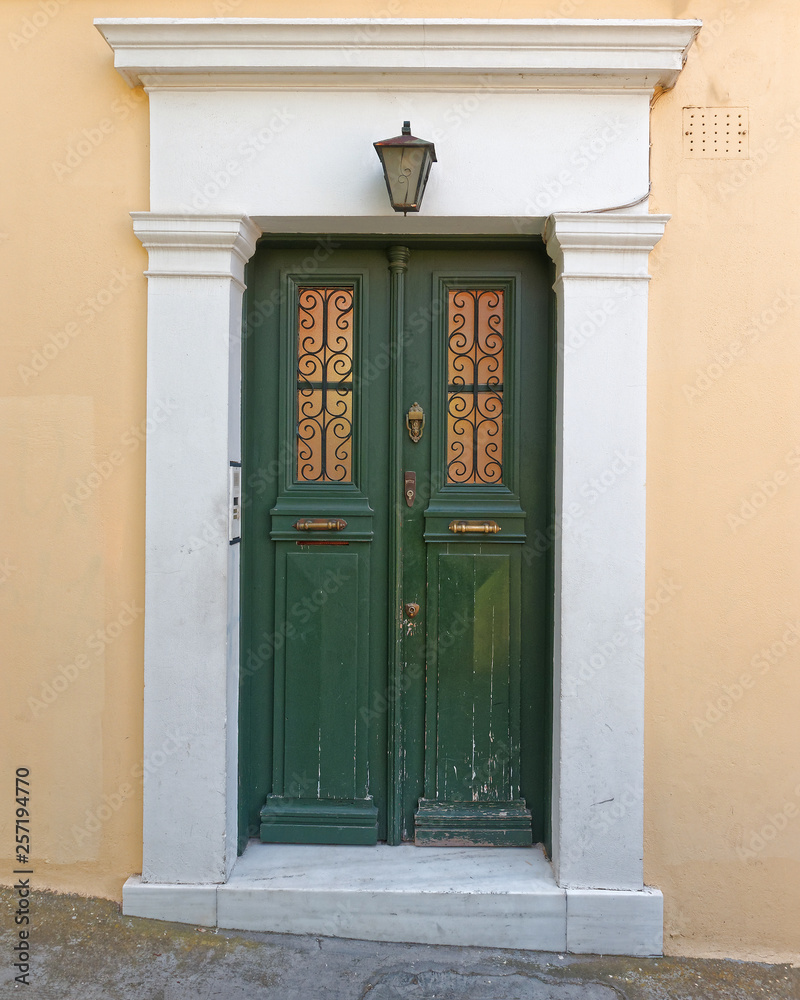 Fototapeta premium vintage house green door, Plaka old neighborhood, Athens Greece