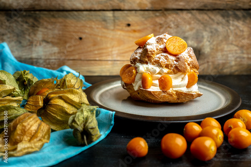 sweet donut with fluffy whipped cream and fruit